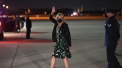 Jill Biden, in a geometric green and black dress, arrives at Andrews Air Force Base in Maryland on April 23, 2021. AFP