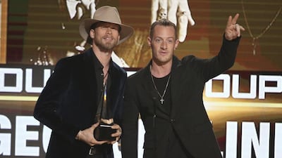 Brian Kelley, left, and Tyler Hubbard, of Florida Georgia Line, accept the award for favorite country duo/group at the American Music Awards at the Microsoft Theater on Sunday, Nov. 20, 2016, in Los Angeles. (Photo by Matt Sayles/Invision/AP)