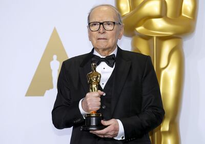 Italian composer Ennio Morricone poses with his Oscar for Best Original Score for 'The Hateful Eight,' during the 88th Academy Awards in Hollywood, California February 28, 2016. Reuters