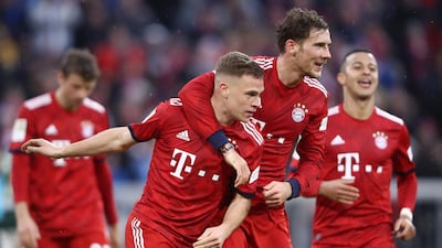 Joshua Kimmich celebrates with teammate Leon Goretzka after scoring Bayern Munich's fifth goal against Wolfsburg at Allianz Arena. Getty