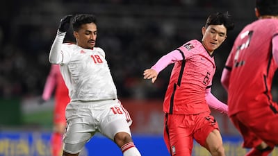 South Korea's Hwang In-beom, centre, and UAE's Abdullah Ramadan fight for the ball in Goyang. AFP