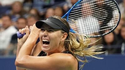 Maria Sharapova hits a return. Don Emmert / AFP