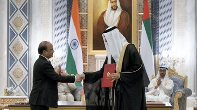 Sheikh Mohammed bin Zayed and Narendra Modi witness an agreement signing between Dr Sultan Ahmed Al Jaber, UAE Minister of State and CEO of ADNOC Group (R) and Shashi Shanker, Chairman and Managing Director of the Oil and Gas Corporation (L). Rashed Al Mansoori / Crown Prince Court - Abu Dhabi
