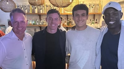 Emanuele Galeppini with golfers Luke Donald and Rory McIlroy, and former footballer Dwight Yorke. Instagram