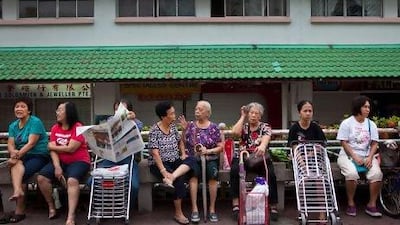 Women at a public housing estate in Singapore. They are being told to be intimate with their husbands two to three times a week to increase their chances of conception during ovulation.