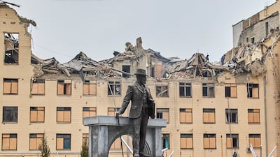 The statue of architect Alexei Beketov in front of the Kharkiv National University of Urban Economy building, damaged by a rocket in Ukraine. EPA