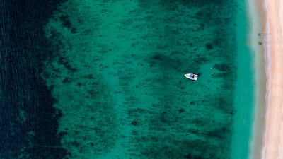 An aerial view shows a boat near the harbour in Sal Rei at Boa Vista island, Cape Verde. AFP