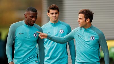 Chelsea's Cesc Fabregas and Tiemoue Bakayoko hcat on their way to the training pitch. John Sibley / Reuters