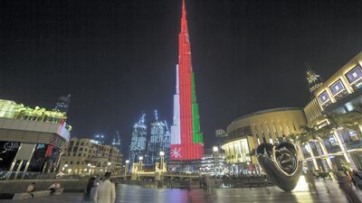 Dubai, United Arab Emirates- Burj Khalifa with the Omani flag for the Omani national day. Leslie Pableo for The National
