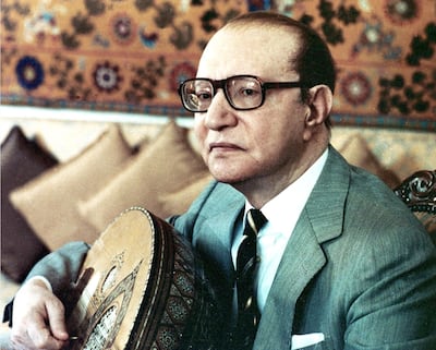 Abdel Wahab playing the oud at his home in Cairo in the 1980s. AFP