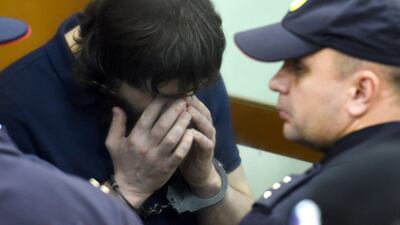 Zaur Dadayev, one of five men convicted of organising and carrying out the contract killing of opposition leader Boris Nemtsov, reacts during the sentencing at the Moscow District Military Court on Thursday. AFP / Vasily Maximov