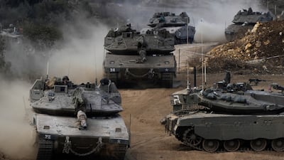 Israeli army tanks in a staging area in northern Israel near the border with Lebanon on Tuesday. AP