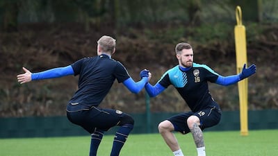 epa05175189 Arsenal team mates Per Mertesacker (L) with Aaron Ramsey during a training session with team mates at Arsenal's training complex at London Colney, north of London, Britain, 22 February 2016. Arsenal play Barcelona in a Champions League Round of 16 soccer match at the Emirates Stadium in London 23 February. EPA/ANDY RAIN