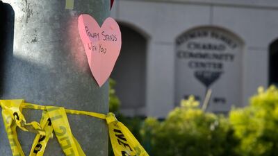 Paper hearts with messages of support are visible at an intersection next to the Chabad of Poway synagogue in Poway, California, 27 April 2019. EPA