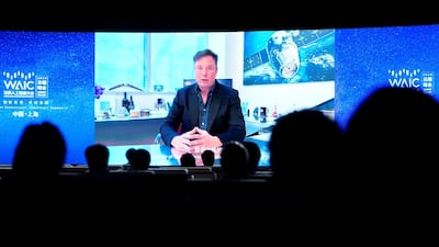 Elon Musk on a screen during a video message at the opening ceremony of WAIC in Shanghai, China. Reuters