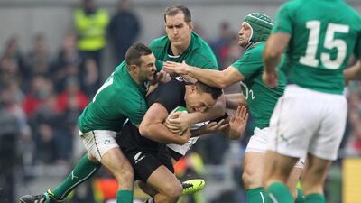 New Zealand flanker Steve Luatua, center, is tackled by Ireland's David Kearney and Peter O'Mahony during their Test match in Dublin on Sunday. Peter Muhly / AFP