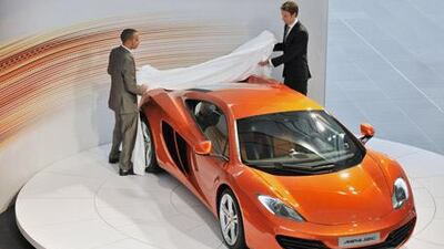 Not only have Lewis Hamilton (left) and Jenson Button helped develop the MP4-12C, they also each have plans to buy one.