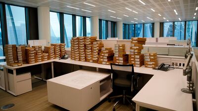 Boxes sits on desks in the consular section of the new United States Embassy building in central London. Alastair Grant / AFP