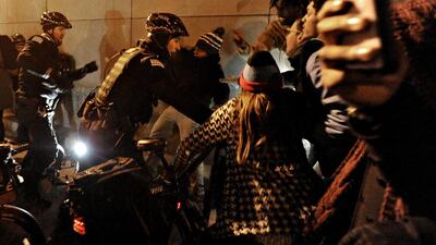 Protesters scuffle with Chicago police, hours before the city released a video of a showing white policeman shooting a black man 16 times. Paul Beaty / AP Photo