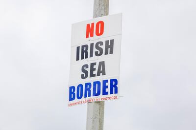 A sign on a lamppost reading "No Irish Sea Border" in the Northern Irish port town of Larne on Wednesday. Bloomberg.