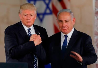 US President Donald Trump and Israel's Prime Minister Benjamin Netanyahu shake hands after delivering a speech in Jerusalem. Mr Trump announced on Twitter it was time for the United States to recognise the Israeli sovereignty over the Golan Heights. AFP