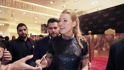 Blake Lively signs autographs for fans at The Dubai Mall while promoting the new Gucci Première fragrance. Sarah Dea / The National