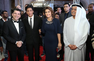 Bollywood stars Shah Rukh Khan and Kajol with Diff chairman Abdulhamid Juma. Getty Images