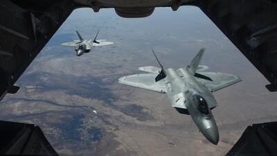 Two US Air Force F-22 Raptors flying above Syria. The country spends $81 billion a year on military presence to protect global oil supplies, a recent study found. Courtesy US Air Force