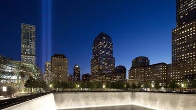 The Tribute in Light shines above a reflecting pool at the National September 11 Memorial on the 11th anniversary of the terrorist attacks of Sept. 11, 2001. Mark Lennihan / AP Photo