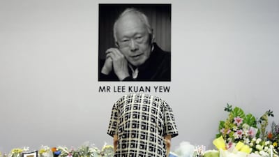 A man bows to pay his respects to the late Lee Kuan Yew, former prime minister of Singapore, at a community club where members of the public can gather to express their condolences on March 23, 2015 as the seven-day national mourning period began. Wong Maye-E/AP Photo