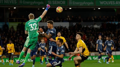 Arsenal goalkeeper Aaron Ramsdale punches clear. Reuters