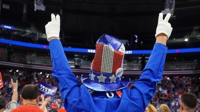 A man dressed as Uncle Sam cheers as Donald Trump holds a campaign kick off rally at the Amway Center in Orlando, Florida. Reuters