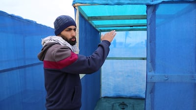 Yahya Al Qassas and his team connect wooden planks and nylon panels, that are becoming increasingly difficult to find. Photo: Rakan Abed El Rahman