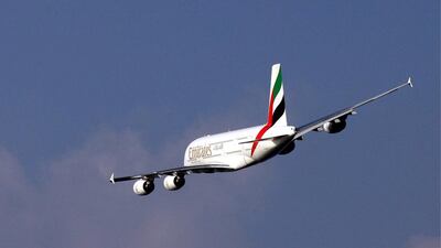 An Emirates A380 takes off over Dubai. Ali Haider / EPA