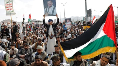 A protestor holds up a photo of top Houthi leader Abdul-Malik al-Houthi in Sana'a, Yemen. The militant group has sought to open another front against Israel amid its war on Gaza and has been attacking vessels in the Red Sea since November. EPA