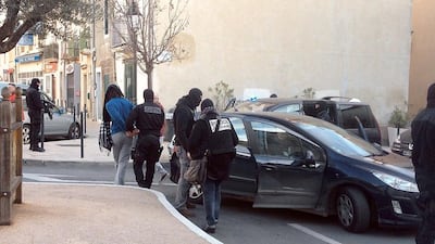 A video grab taken on January 27, 2015 in Lunel, southern France, shows French GIPN and police officers arresting a person during an anti-militant operation. Caroline Rossignol/AFP Photo