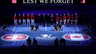The tennis teams of Switzerland and Canada observe a two-minute silence in honour of Armistice Day before their Billie Jean King Cup match at Emirates Arena in Glasgow, Scotland. Getty