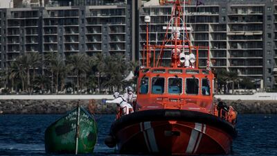 Spanish rescue services respond to a capsized migrant boat in the Canary Islands. AP