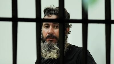 Mr Al Sheikh Hussein was reportedly armed with a rifle and is said to have doused the interior of the bank with petrol. AP