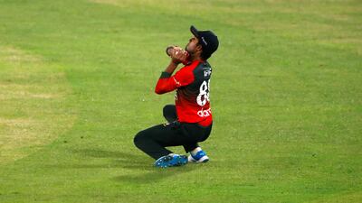 Bangladesh's Afif Hossain takes a catch to dismiss Australia's Adam Zampa.