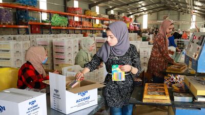 Workers at Jordan Chalk in Karak, south of Amman. The kingdom is trying to overhaul its economy as unemployment rises. AFP