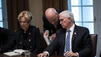 Vice President Mike Pence and his chief of staff Mark Short confer during a meeting with Debbie Birx, the White House coronavirus response co-ordinator. AFP