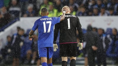 Leicester City's Kasper Schmeichel is consoled by Danny Simpson as he walks off to be substituted after sustaining an injury. Darren Staples / Reuters
