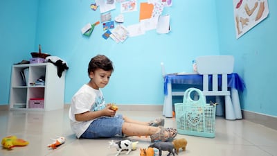 Three-year-old Mohammed Hedi plays at the Dimensions Centre, which helps kids with special needs from lower income backgrounds but now faces closure. Chris Whiteoak / The National