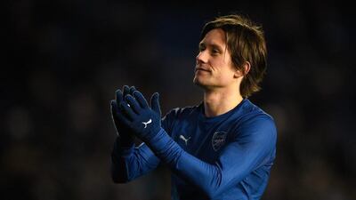 Tomas Rosicky of Arsenal salutes the travelling fans at the end of Arsenal's 3-2 FA Cup fourth round win on Sunday against Brighton. Mike Hewitt / Getty Images