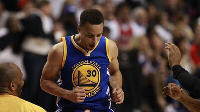 Golden State Warriors guard Stephen Curry reacts during overtime on Monday of his team's Game 4 win against the Portland Trail Blazers in the NBA play-offs second round. Steve DiPaola / EPA / May 9, 2016