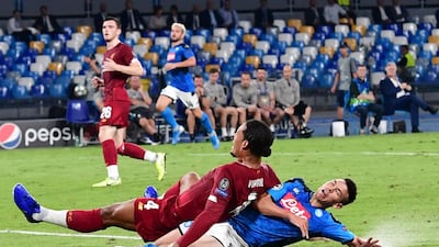 Napoli's Hirving Lozano and Liverpool's Virgil van Dijk in action. EPA