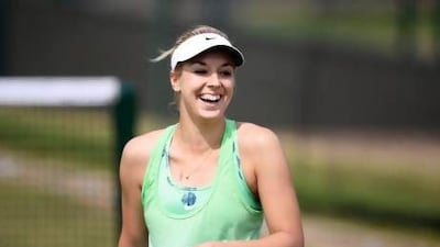 Sabine Lisicki is all smiles during a practice session at Wimbledon on Friday. Lisicki will bring her power game against Marion Bartoli's energetic and unorthodox style in the women's final on Saturday.