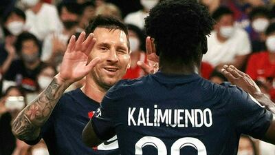 Lionel Messi congratulates French forward Arnaud Kalimuendo on his goal. AFP