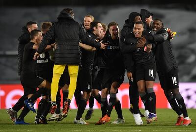 Borussia Monchengladbach players celebrate in Madrid after finding out they had secured a Champions League last-16 spot. AP